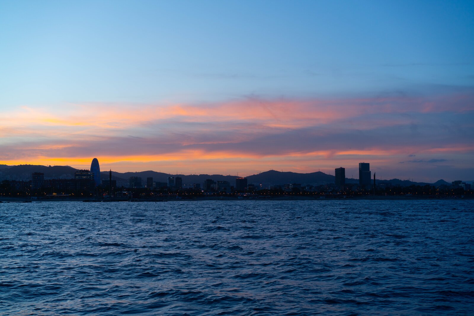 Barcelona harbor at sunset from the water