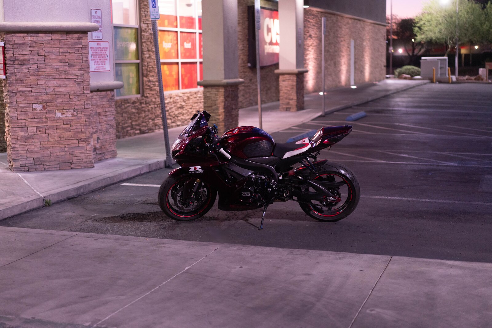 A parked motorcycle at night on a Vegas side street